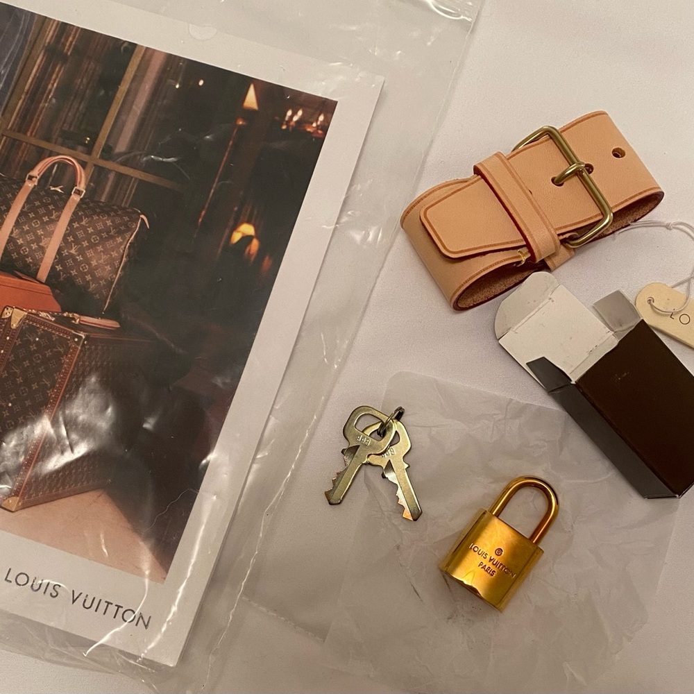 Louis Vuitton Gold Lock with Beige Leather Strap